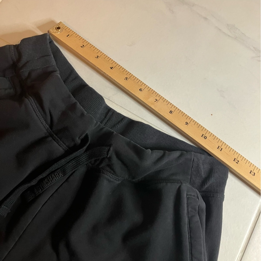 Gymshark Black sweatshirt material Athletic Shorts. Waist tie. Zipper pockets. - Picture 9 of 10